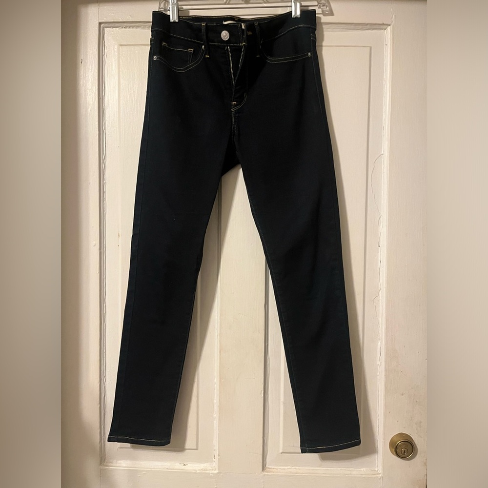 Dark wash Levi 311 shaping skinny jeans.